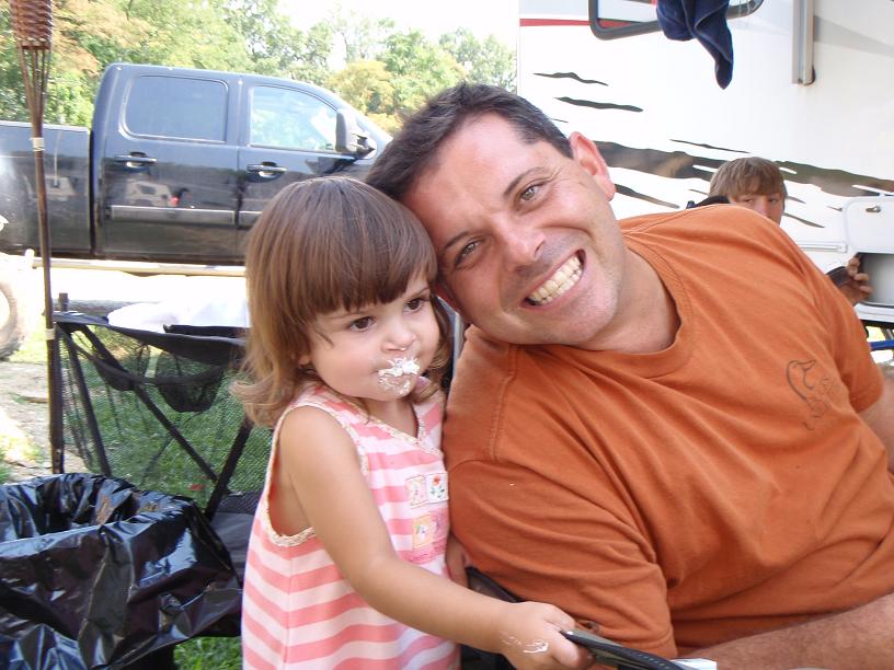 Shelby eating a cupcake with Daddy